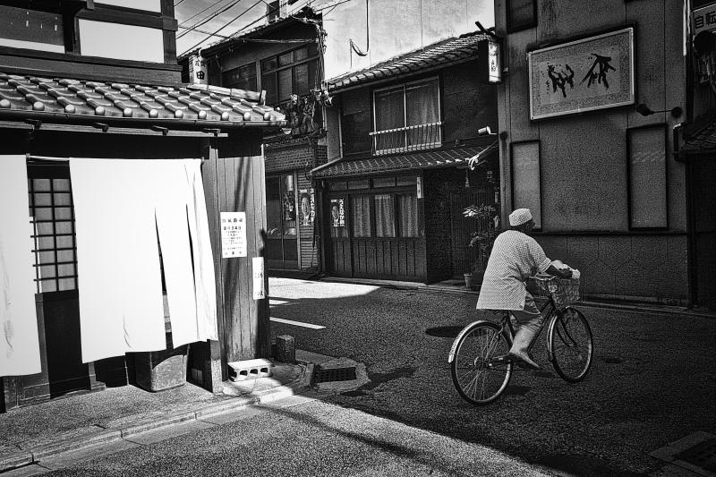 Man on a Bicycle in Kyoto, Japan